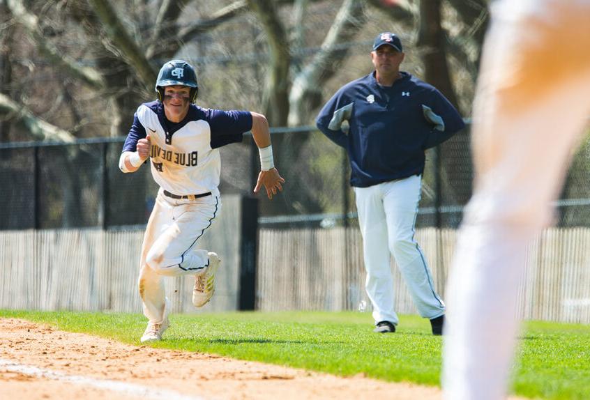 Poly Prep baseball athlete running for the base